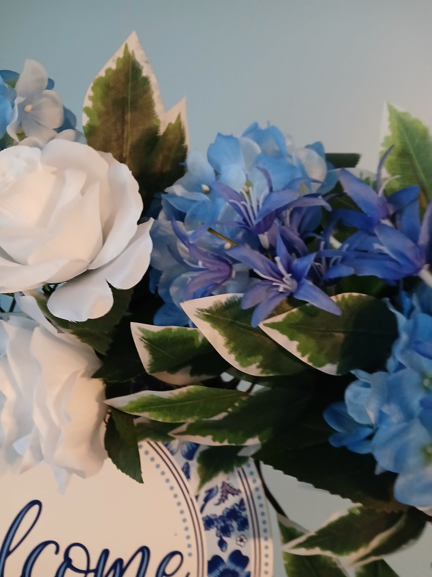 18" Grapevine Spring Wreath – Blue & White Flowers with Welcome Sign